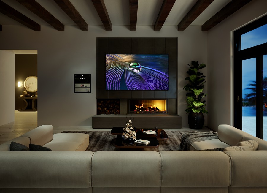 A living room with a Sony TV displaying vibrant colors above a fireplace.