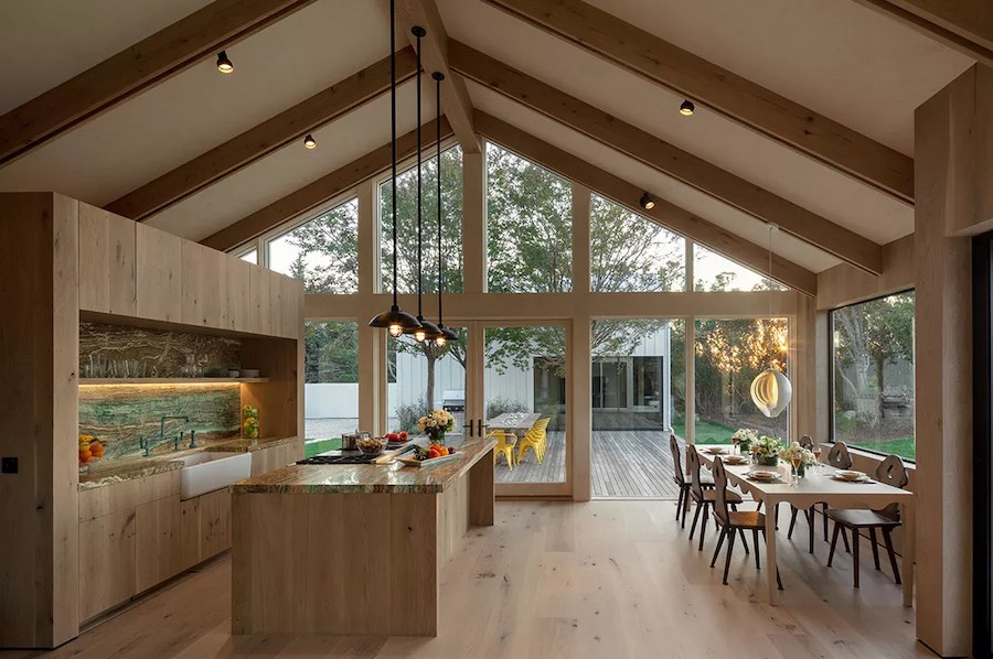 A modern kitchen in a Cape Cod home with Lutron lighting fixtures. 